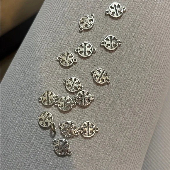 Tory Burch charms. Silver. New. 14 charms. - Picture 1 of 5